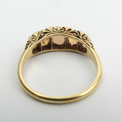 49 - 18ct gold, tested, opal five stone ring with diamond points. 3.9 grams, Size Q1/2, 7.4mm wide. 
UK P... 