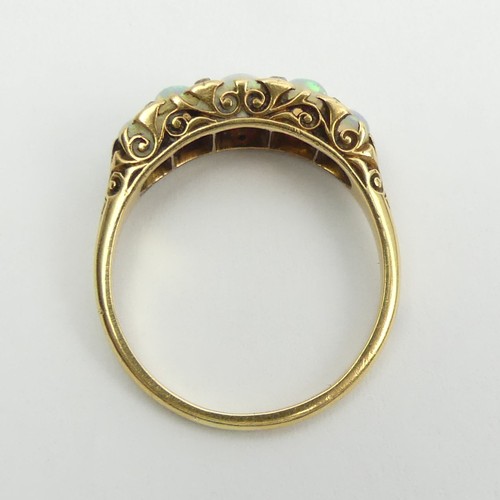 49 - 18ct gold, tested, opal five stone ring with diamond points. 3.9 grams, Size Q1/2, 7.4mm wide. 
UK P... 