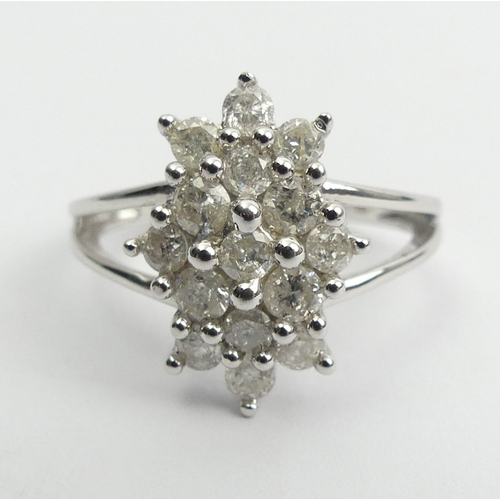 6 - 9ct white gold diamond, (approx .6ct) cluster ring, 3.8 grams, Size N1/2, 15mm wide. UK Postage £12