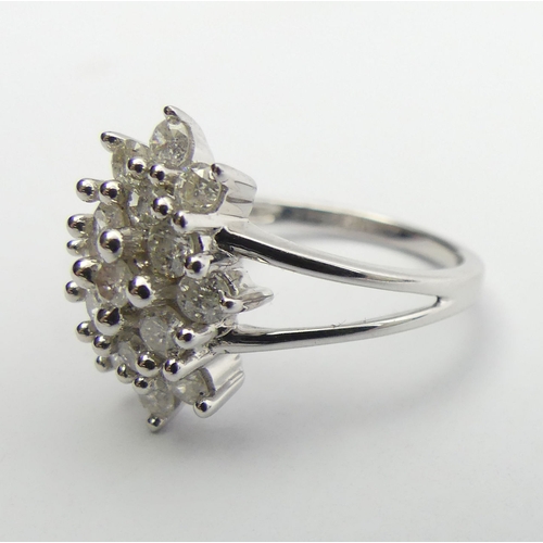 6 - 9ct white gold diamond, (approx .6ct) cluster ring, 3.8 grams, Size N1/2, 15mm wide. UK Postage £12