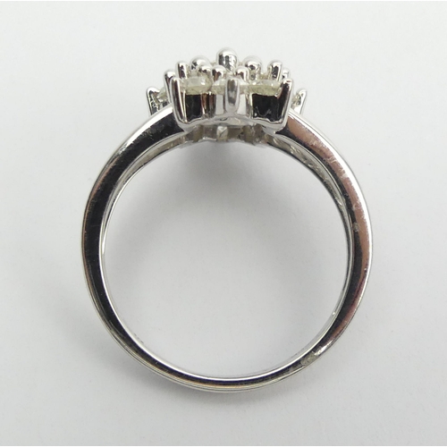 6 - 9ct white gold diamond, (approx .6ct) cluster ring, 3.8 grams, Size N1/2, 15mm wide. UK Postage £12