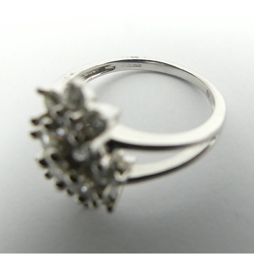 6 - 9ct white gold diamond, (approx .6ct) cluster ring, 3.8 grams, Size N1/2, 15mm wide. UK Postage £12