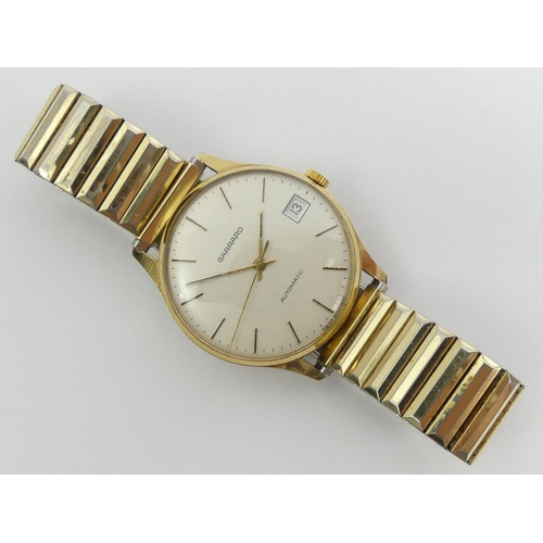 82 - Gents 9ct gold Garrard date adjust automatic movement watch on an expanding gold plated strap, 35mm ... 