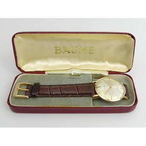 87 - Baume 14ct Gold manual wind Gents watch, 33mm, UK Postage £12 
Condition Report: In good working ord... 