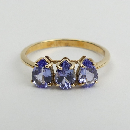 11 - 9ct gold three stone pear shape tanzanite ring, 1.6 grams, 6mm wide, Size N1/2. 
UK Postage £12