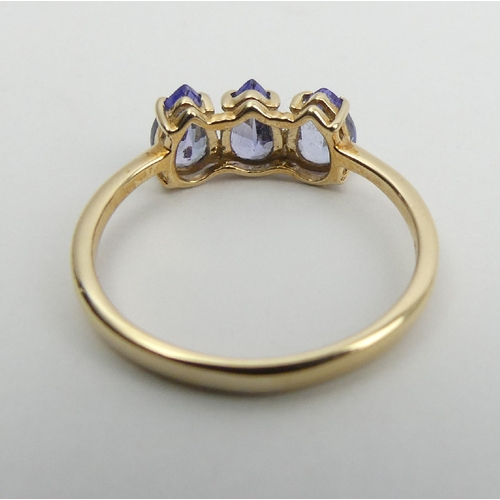 11 - 9ct gold three stone pear shape tanzanite ring, 1.6 grams, 6mm wide, Size N1/2. 
UK Postage £12