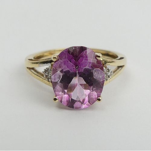 12 - 9ct gold oval pink topaz and diamond ring, 2.5 grams, 11mm wide, Size O. UK Postage £12