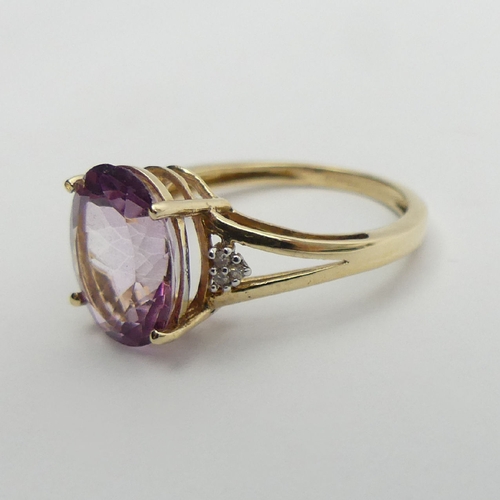 12 - 9ct gold oval pink topaz and diamond ring, 2.5 grams, 11mm wide, Size O. UK Postage £12