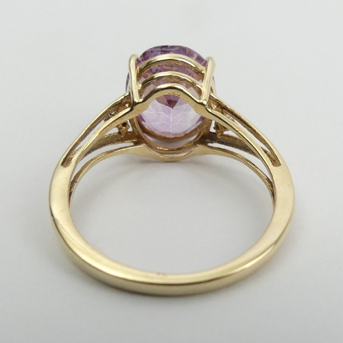 12 - 9ct gold oval pink topaz and diamond ring, 2.5 grams, 11mm wide, Size O. UK Postage £12