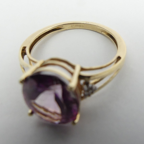 12 - 9ct gold oval pink topaz and diamond ring, 2.5 grams, 11mm wide, Size O. UK Postage £12