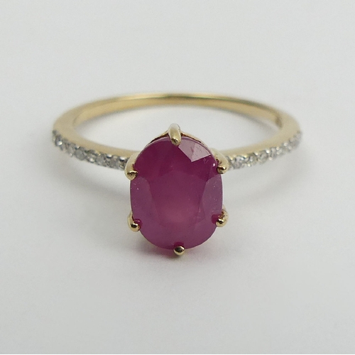 14 - 9ct gold, ruby and diamond ring, 1.9 grams, 9mm wide, Size N1/2. UK Postage £12