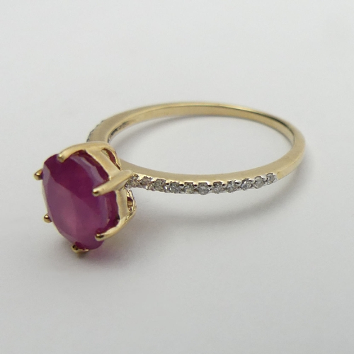 14 - 9ct gold, ruby and diamond ring, 1.9 grams, 9mm wide, Size N1/2. UK Postage £12