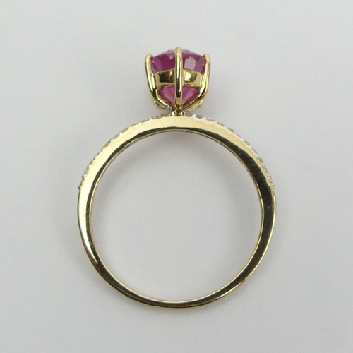 14 - 9ct gold, ruby and diamond ring, 1.9 grams, 9mm wide, Size N1/2. UK Postage £12