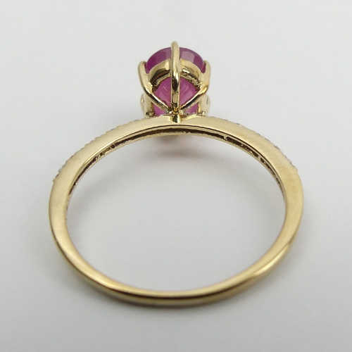 14 - 9ct gold, ruby and diamond ring, 1.9 grams, 9mm wide, Size N1/2. UK Postage £12