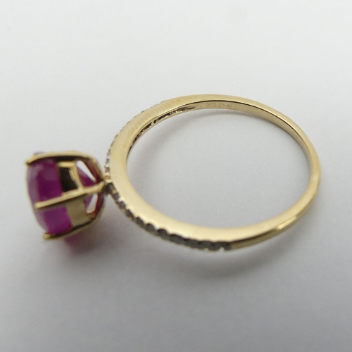 14 - 9ct gold, ruby and diamond ring, 1.9 grams, 9mm wide, Size N1/2. UK Postage £12