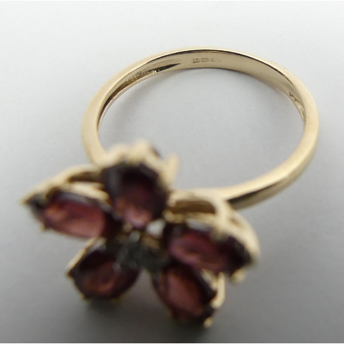 17 - 9ct gold rhodolite and diamond flower design ring, 2.6 grams, 14.5mm wide, Size N1/2    UK Postage £... 