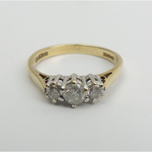 2 - 9ct gold three stone diamond ring (50 point total), 2 grams, 5.1mm wide. Size N 
UK Postage £12