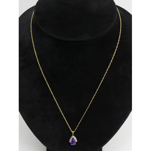 23 - 9ct gold amethyst pendant and chain, 1.4 grams, pendant 16mm, chain 45cm. UK Postage £12