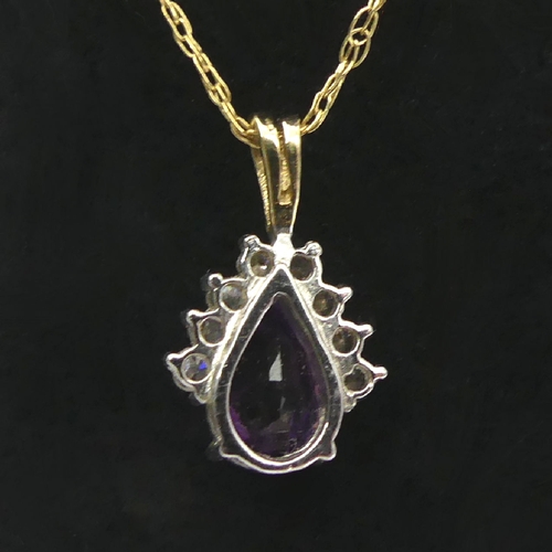 23 - 9ct gold amethyst pendant and chain, 1.4 grams, pendant 16mm, chain 45cm. UK Postage £12