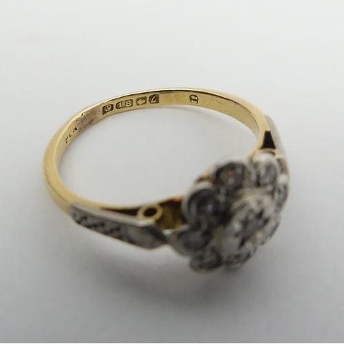 5 - 18ct gold diamond daisy design ring, 2.5 grams 9.2mm. Size I. UK Postage £12