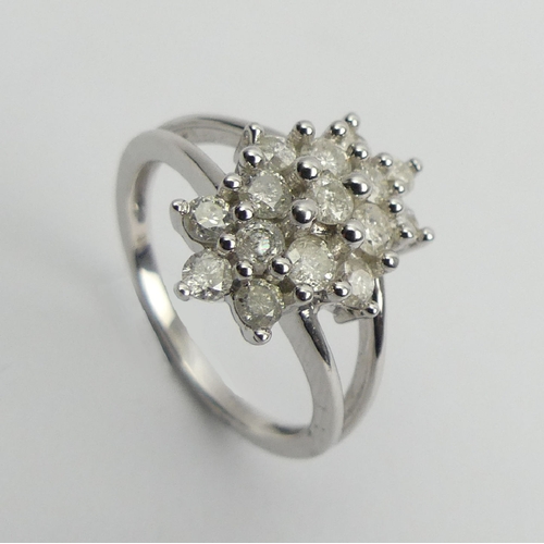 6 - 9ct white gold diamond, (approx .6ct) cluster ring, 3.8 grams, Size N1/2, 15mm wide. UK Postage £12