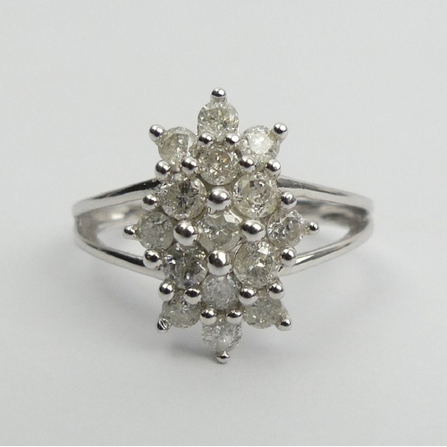 6 - 9ct white gold diamond, (approx .6ct) cluster ring, 3.8 grams, Size N1/2, 15mm wide. UK Postage £12