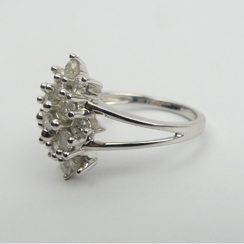 6 - 9ct white gold diamond, (approx .6ct) cluster ring, 3.8 grams, Size N1/2, 15mm wide. UK Postage £12