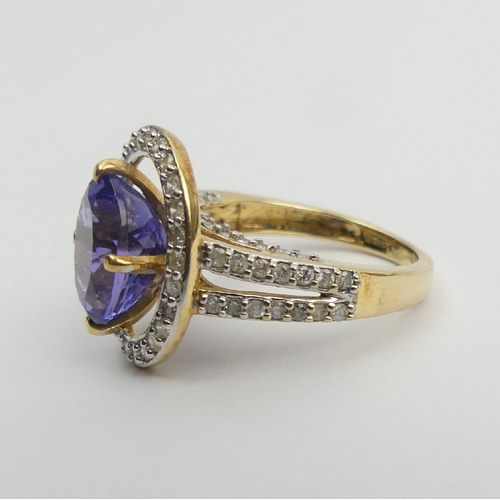 7 - 18ct gold oval tanzanite diamond halo ring with diamond set shoulders, 6.5 grams 
Size N1/2. UK Post... 