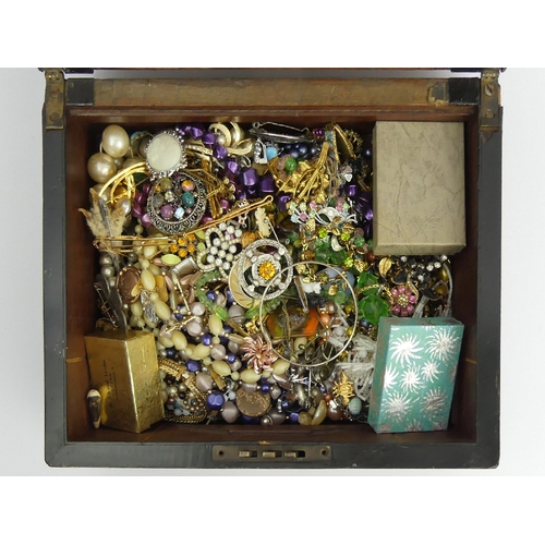 42 - A box of costume and other jewellery including a 9ct gold back and front locket and stone set brooch... 