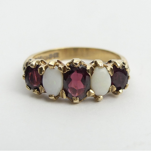 45 - 9ct gold opal and garnet ring, 4.1 grams, 8.5mm, Size Q1/2. UK Postage £12.