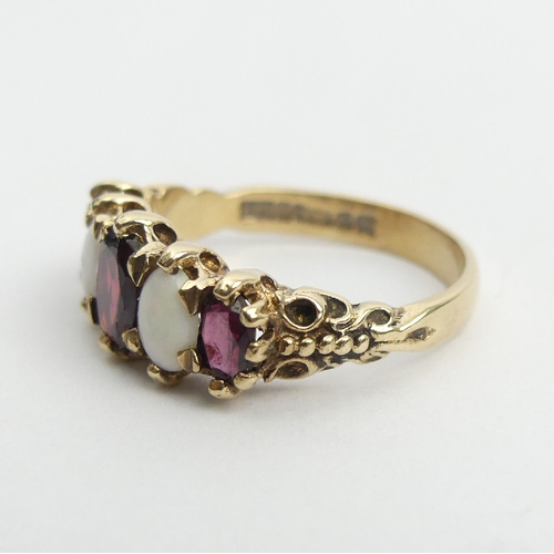 45 - 9ct gold opal and garnet ring, 4.1 grams, 8.5mm, Size Q1/2. UK Postage £12.