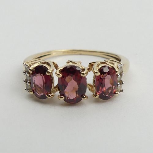 48 - 9ct gold rhodolite and diamond ring, 2.5 grams, 7.2mm, Size N1/2. UK Postage £12.