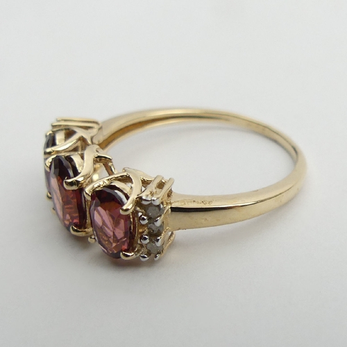 48 - 9ct gold rhodolite and diamond ring, 2.5 grams, 7.2mm, Size N1/2. UK Postage £12.