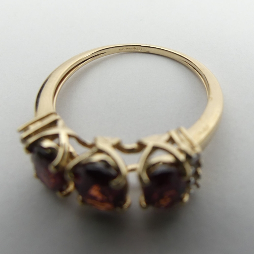 48 - 9ct gold rhodolite and diamond ring, 2.5 grams, 7.2mm, Size N1/2. UK Postage £12.