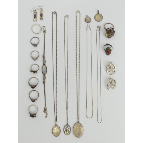 64 - A bag of silver rings, lockets, chains and a stone set bracelet, 75 grams. UK Postage £12.