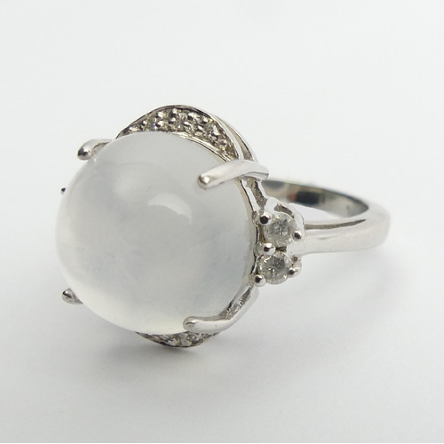 70 - 9ct white gold moonstone and diamond ring, 5.7 grams, 16mm UK Postage £12.