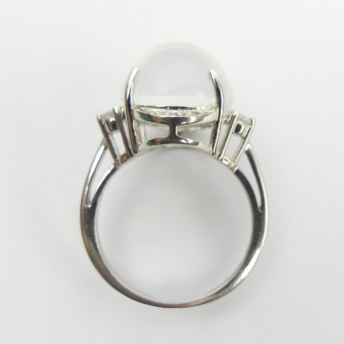 70 - 9ct white gold moonstone and diamond ring, 5.7 grams, 16mm UK Postage £12.