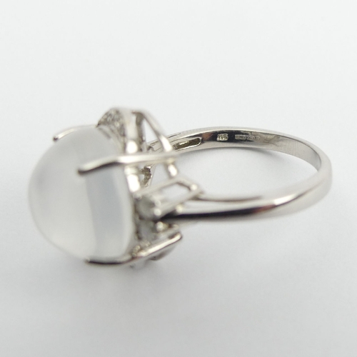 70 - 9ct white gold moonstone and diamond ring, 5.7 grams, 16mm UK Postage £12.