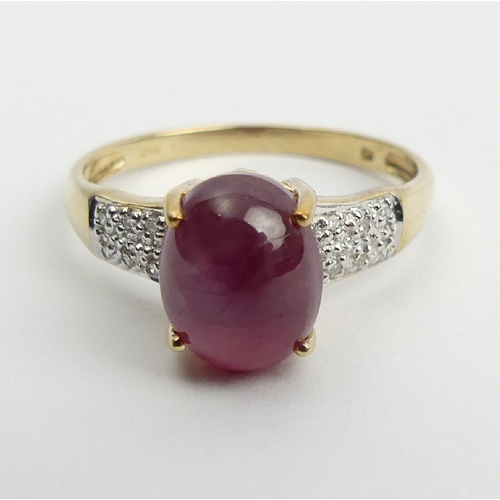 71 - 9ct gold star ruby and diamond ring, 2.2 grams, 9.1mm, Size N1/2. UK Postage £12.