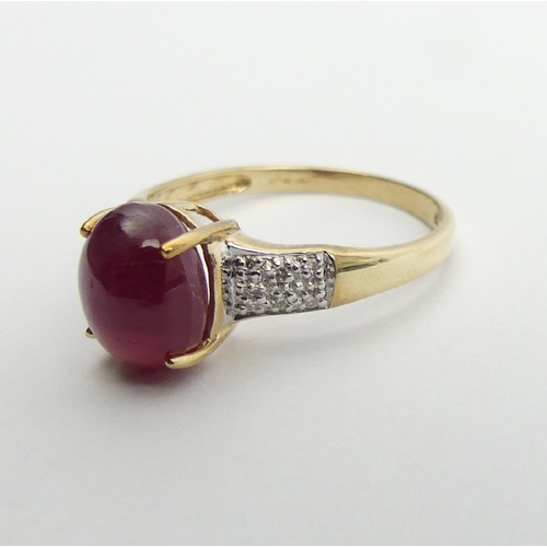 71 - 9ct gold star ruby and diamond ring, 2.2 grams, 9.1mm, Size N1/2. UK Postage £12.