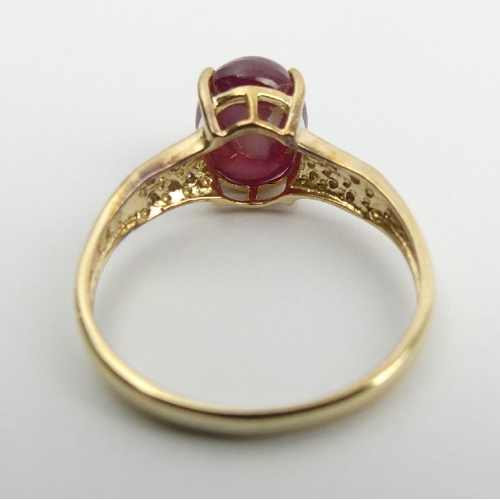 71 - 9ct gold star ruby and diamond ring, 2.2 grams, 9.1mm, Size N1/2. UK Postage £12.