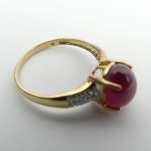 71 - 9ct gold star ruby and diamond ring, 2.2 grams, 9.1mm, Size N1/2. UK Postage £12.