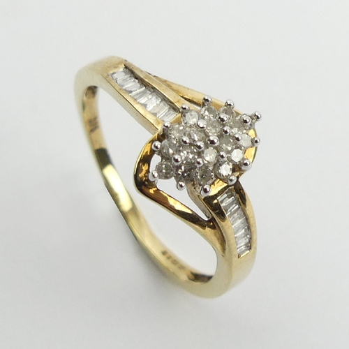 72 - 9ct gold cluster ring, with diamond set shoulders, 2.1 grams, 9.7mm, Size N1/2. UK Postage £12.