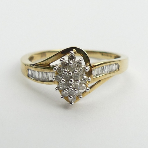 72 - 9ct gold cluster ring, with diamond set shoulders, 2.1 grams, 9.7mm, Size N1/2. UK Postage £12.