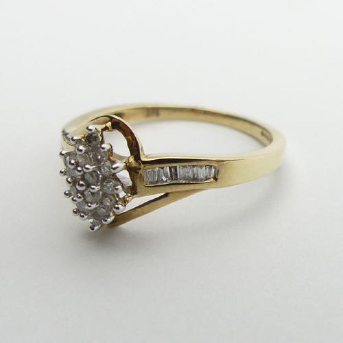 72 - 9ct gold cluster ring, with diamond set shoulders, 2.1 grams, 9.7mm, Size N1/2. UK Postage £12.