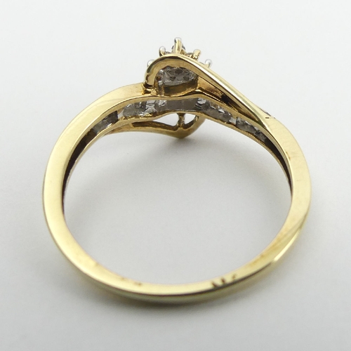 72 - 9ct gold cluster ring, with diamond set shoulders, 2.1 grams, 9.7mm, Size N1/2. UK Postage £12.