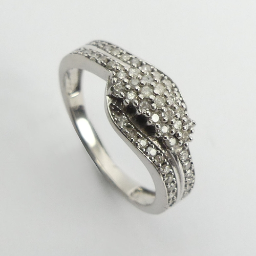 73 - Sterling silver and diamond ring, 2.6 grams, 8.5mm, Size N1/2. UK Postage £12.