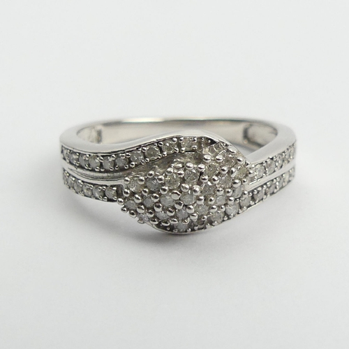 73 - Sterling silver and diamond ring, 2.6 grams, 8.5mm, Size N1/2. UK Postage £12.