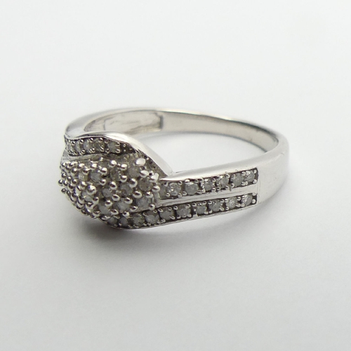 73 - Sterling silver and diamond ring, 2.6 grams, 8.5mm, Size N1/2. UK Postage £12.