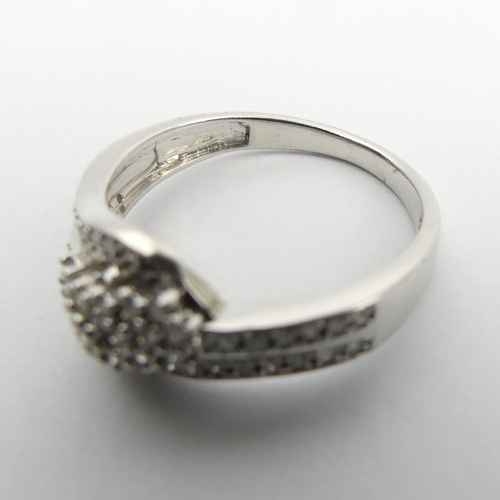 73 - Sterling silver and diamond ring, 2.6 grams, 8.5mm, Size N1/2. UK Postage £12.